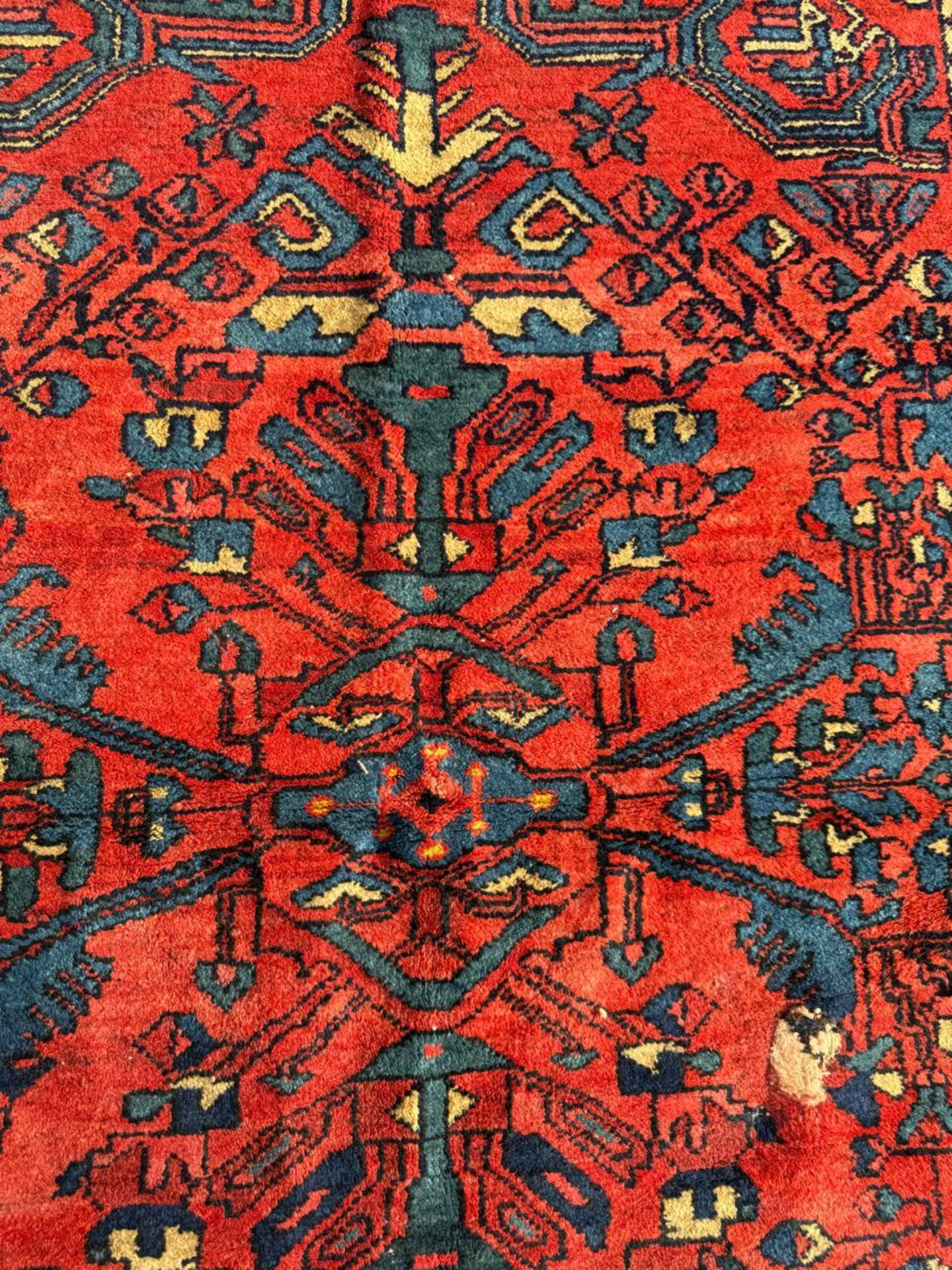 Brick red field with deep indigo medallion outline

