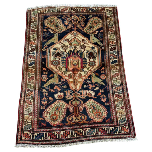 Antique Hamadan rug with navy blue field and central medallion

