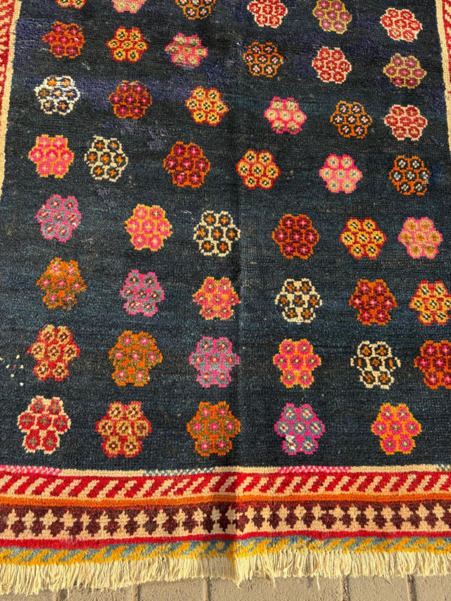 Deep indigo-navy background with jewel tones

