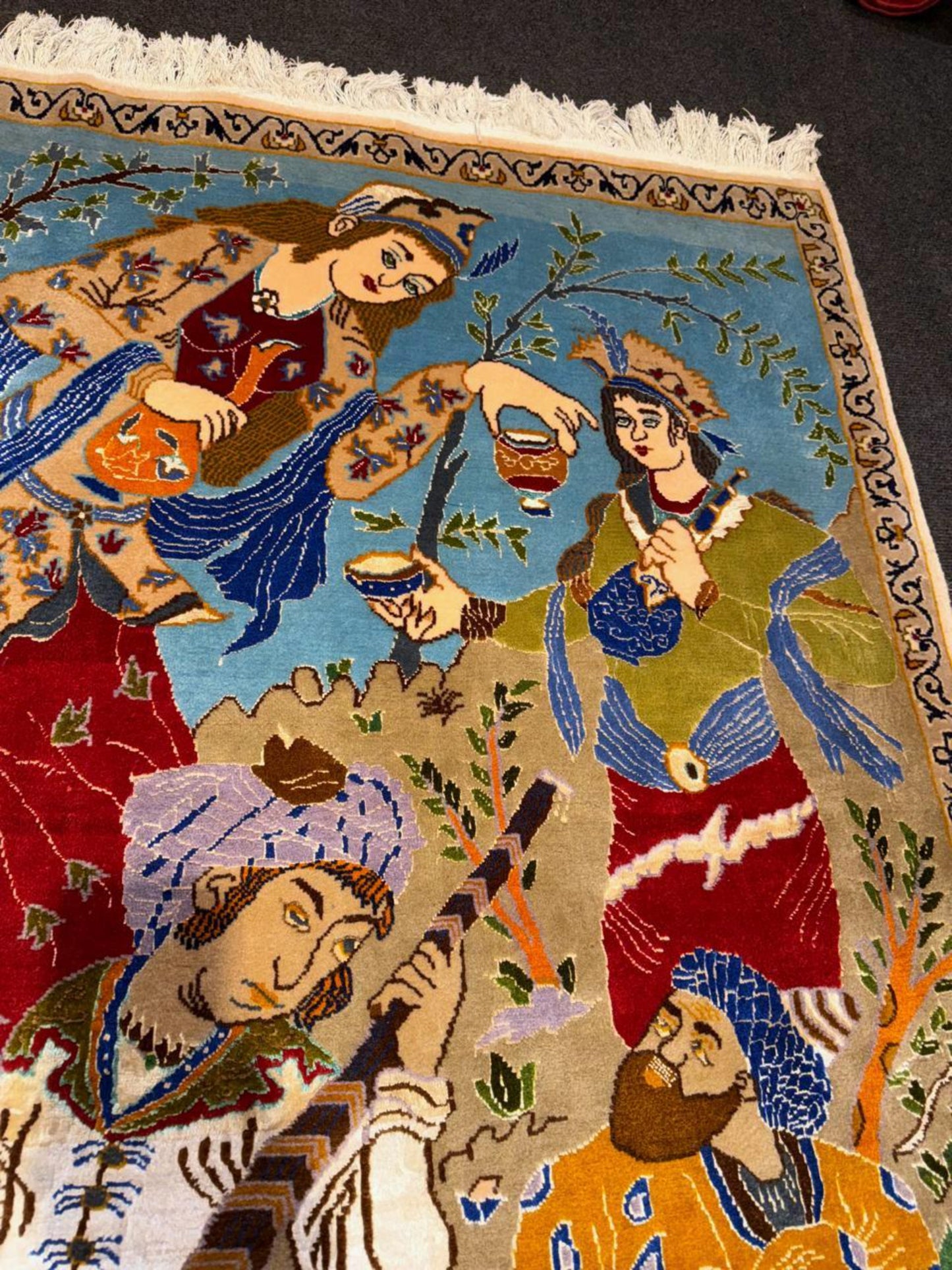 Figurative composition with traditional attire details

