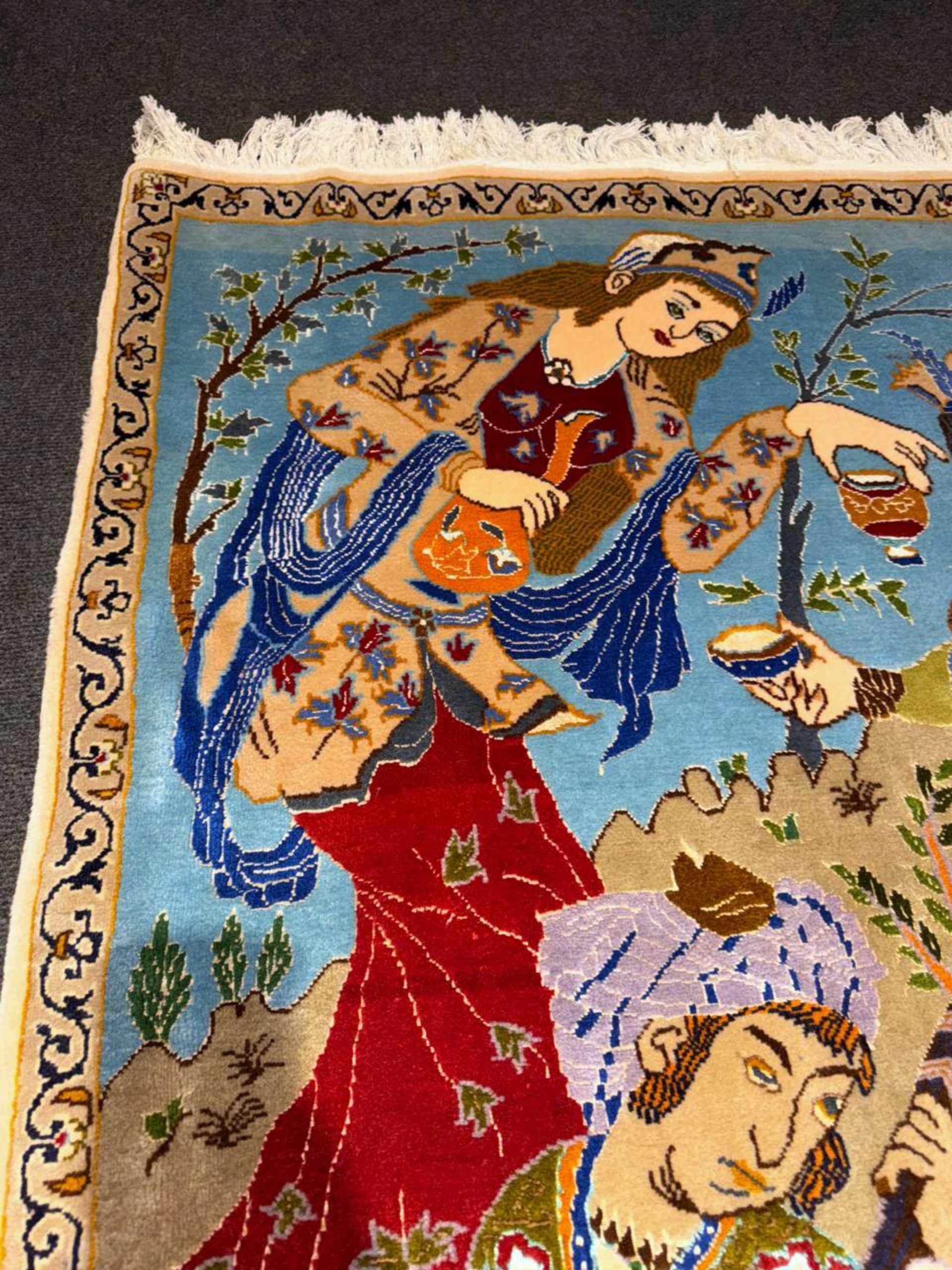 Close-up of figures sharing ceremonial cup

