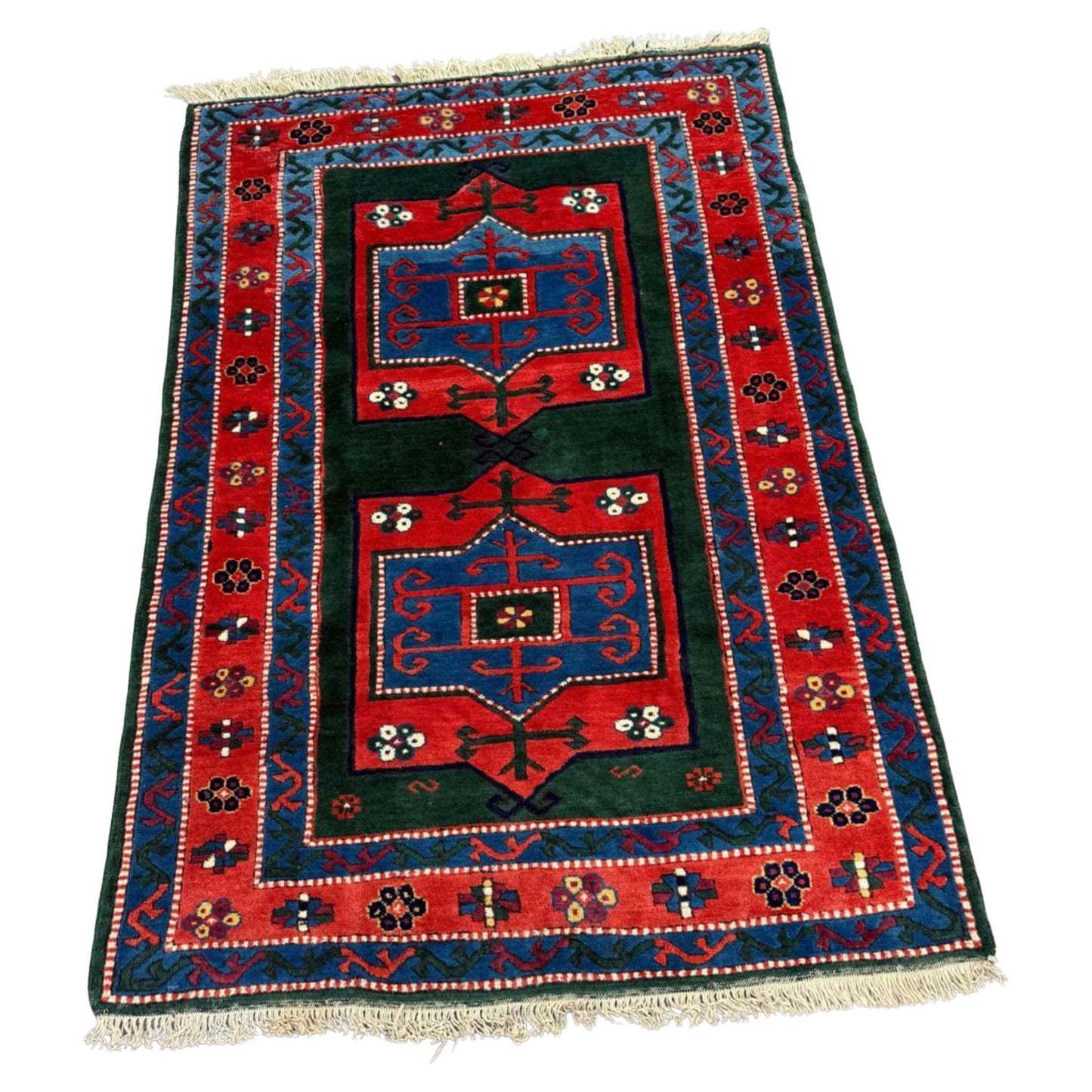 Vintage Kazak rug with three geometric medallions

