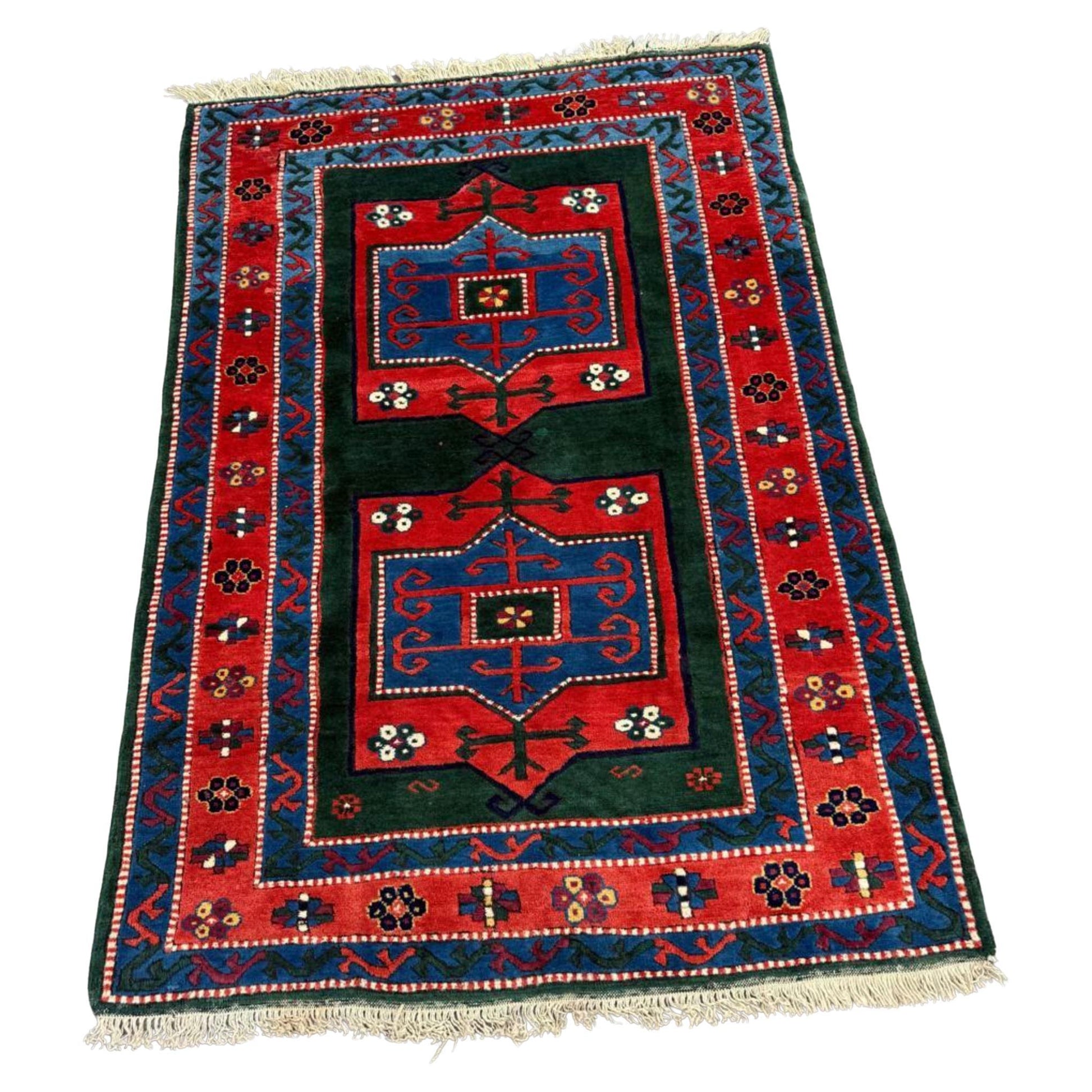 Vintage Kazak rug with three geometric medallions

