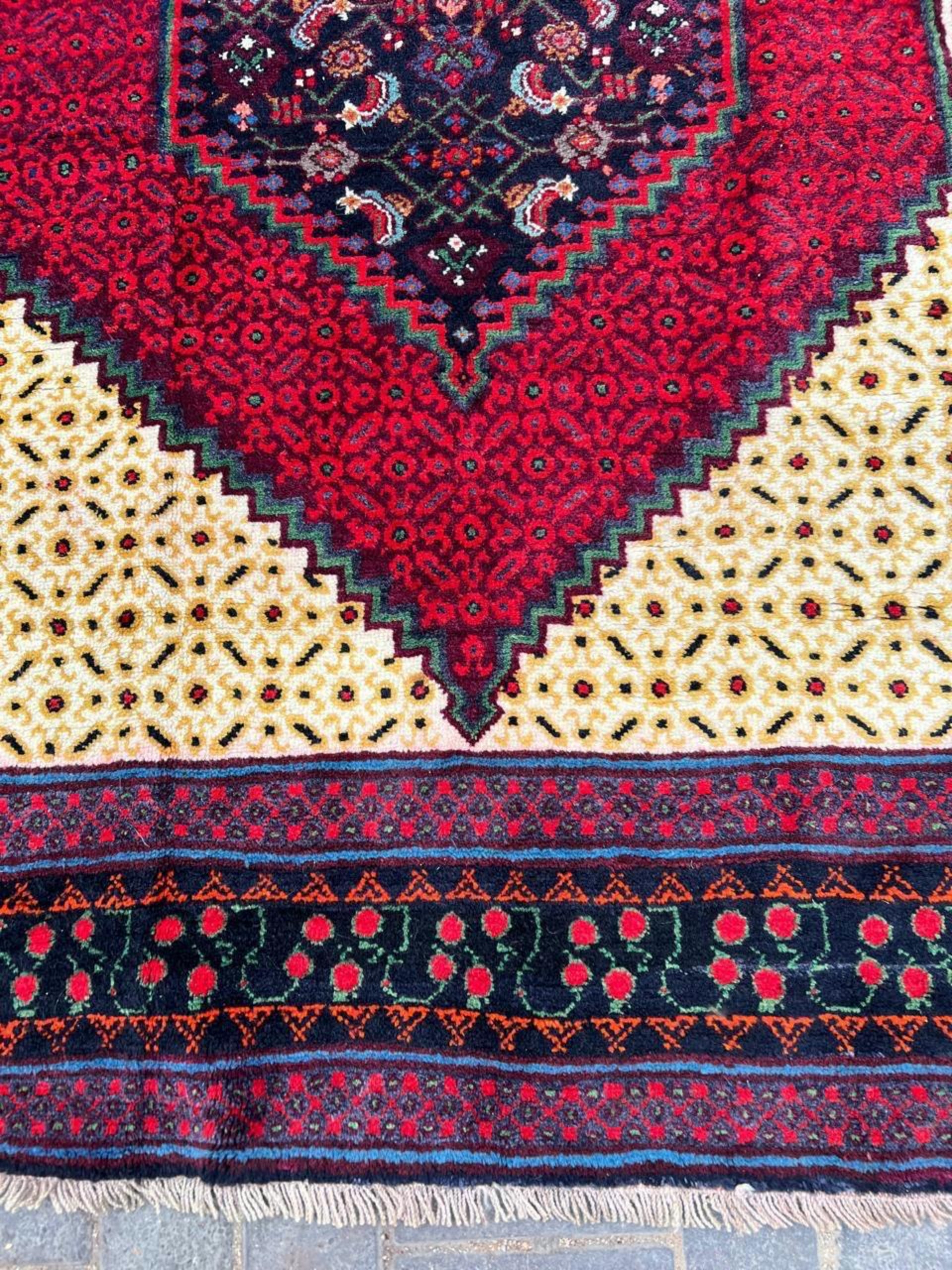 Deep indigo and burgundy red tribal motifs

