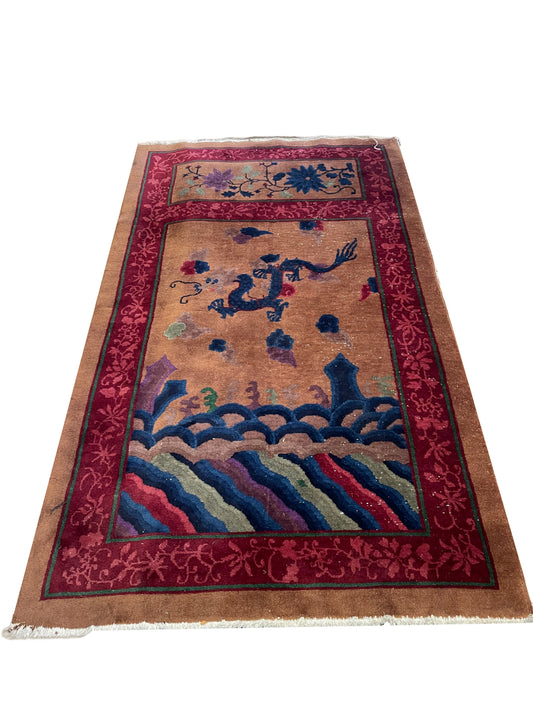 Full front view of the Art Deco Chinese rug showcasing the central dragon motif.

