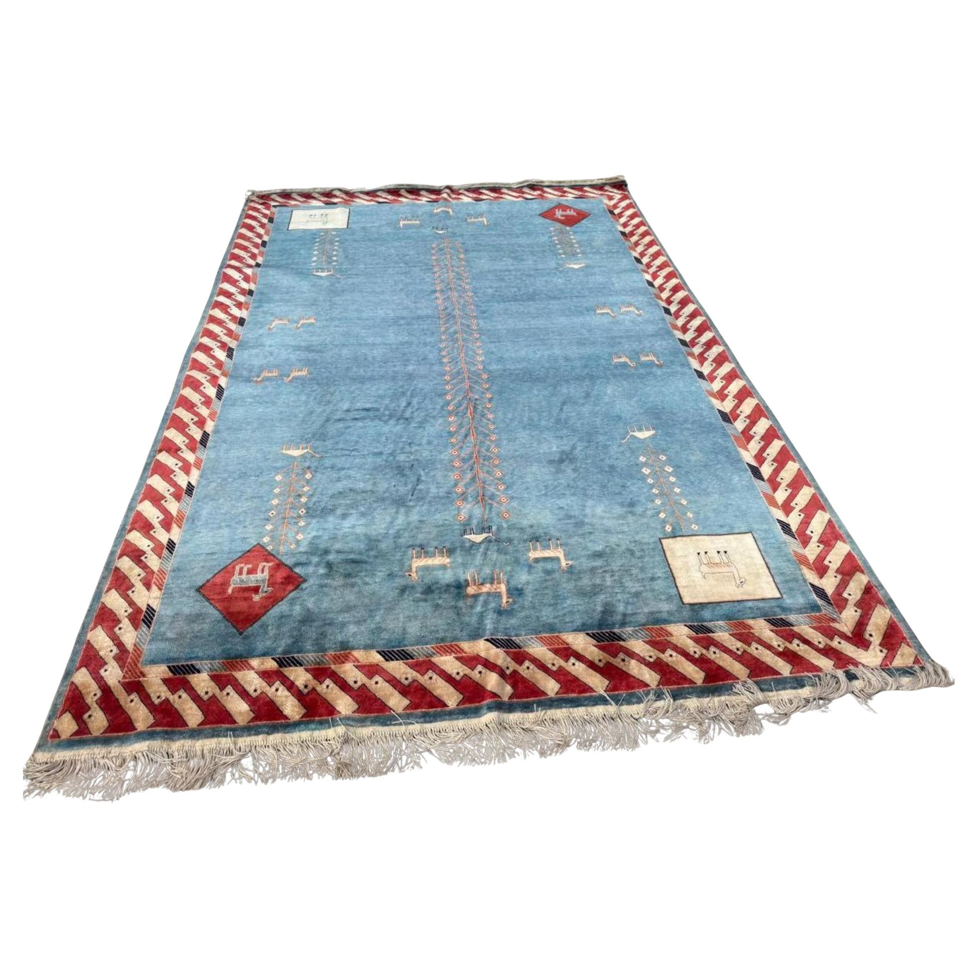 Full top view of the vintage Art Deco Chinese silk rug showing the central geometric medallion.

