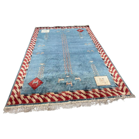 Full top view of the vintage Art Deco Chinese silk rug showing the central geometric medallion.

