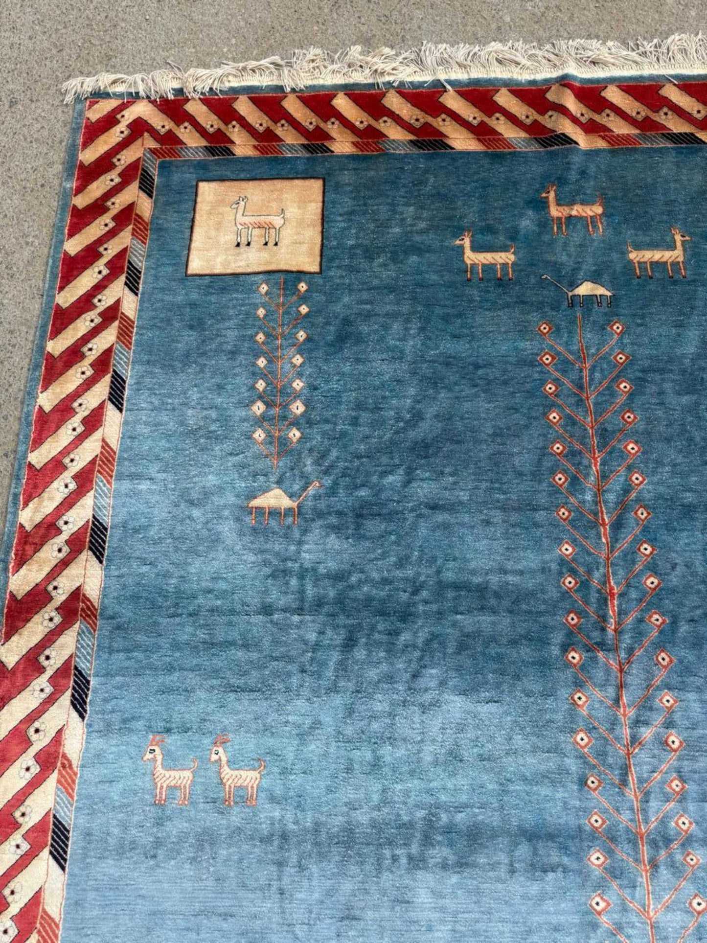 Close-up detail of the angular central medallion in charcoal grey and taupe.

