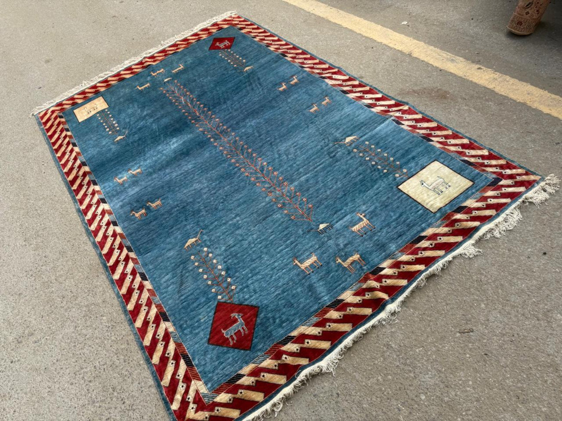Texture shot highlighting the fine, lush pile of the hand-knotted silk.

