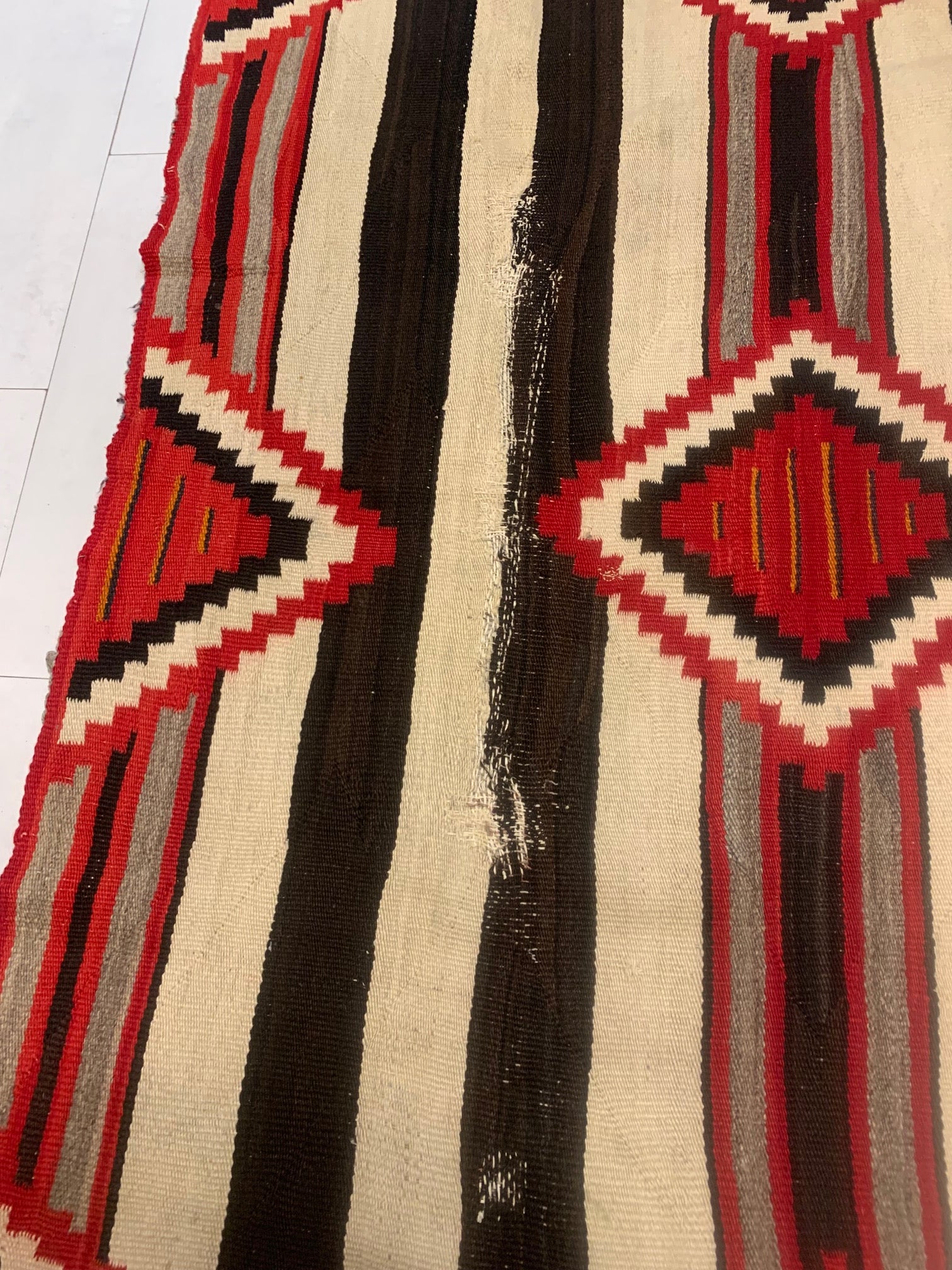Intricate Detailing and Cultural Symbolism Reflecting Navajo Heritage on Vintage American Navajo Rug - 1880s
