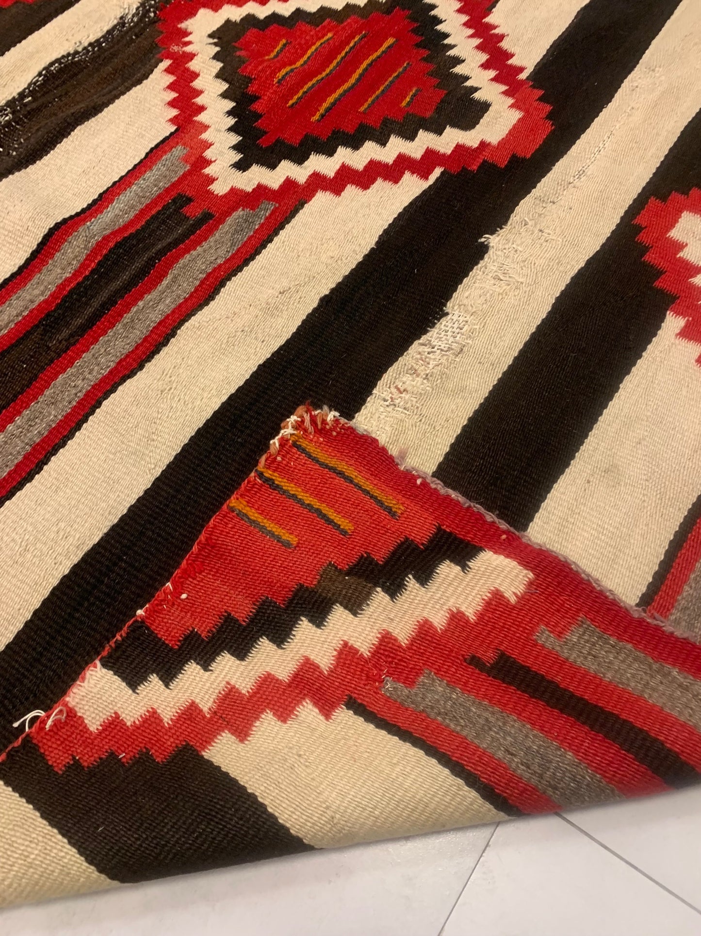 Frayed Edges and Subtle Imperfections Testifying to Authenticity of Handmade American Navajo Rug - 1880s