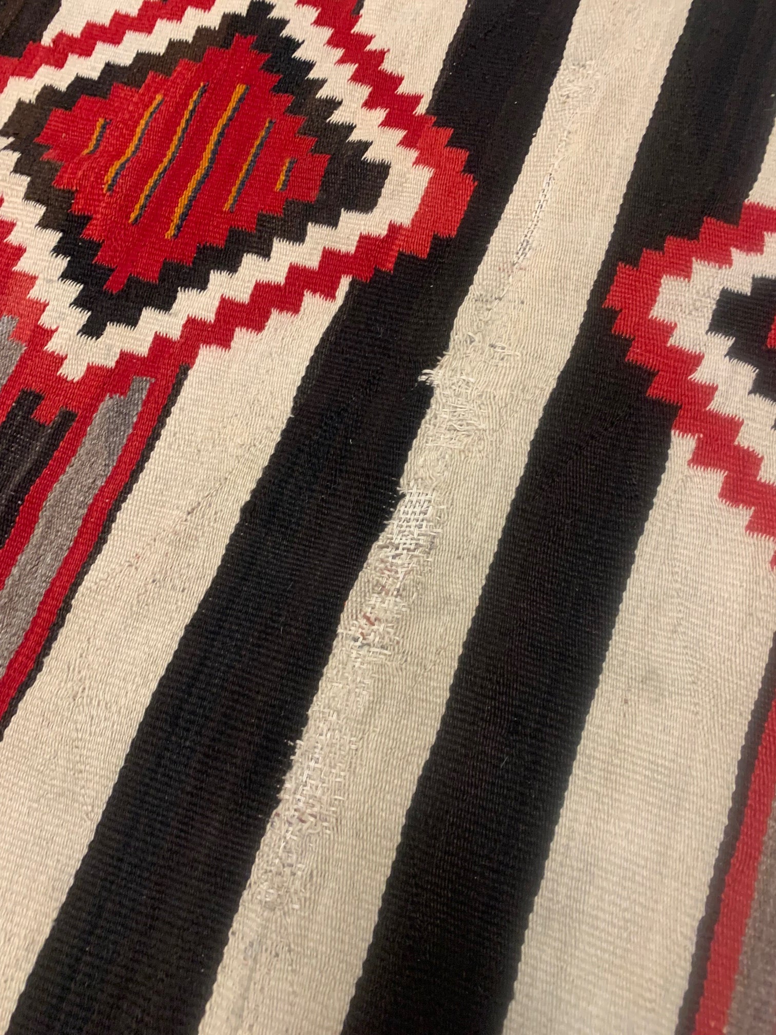 Handcrafted Geometric Patterns Evoking Cultural Significance on Vintage American Navajo Rug - 1880s