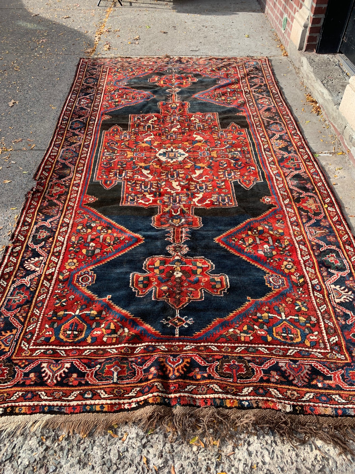 Large rectangular Persian wool rug for living spaces.
