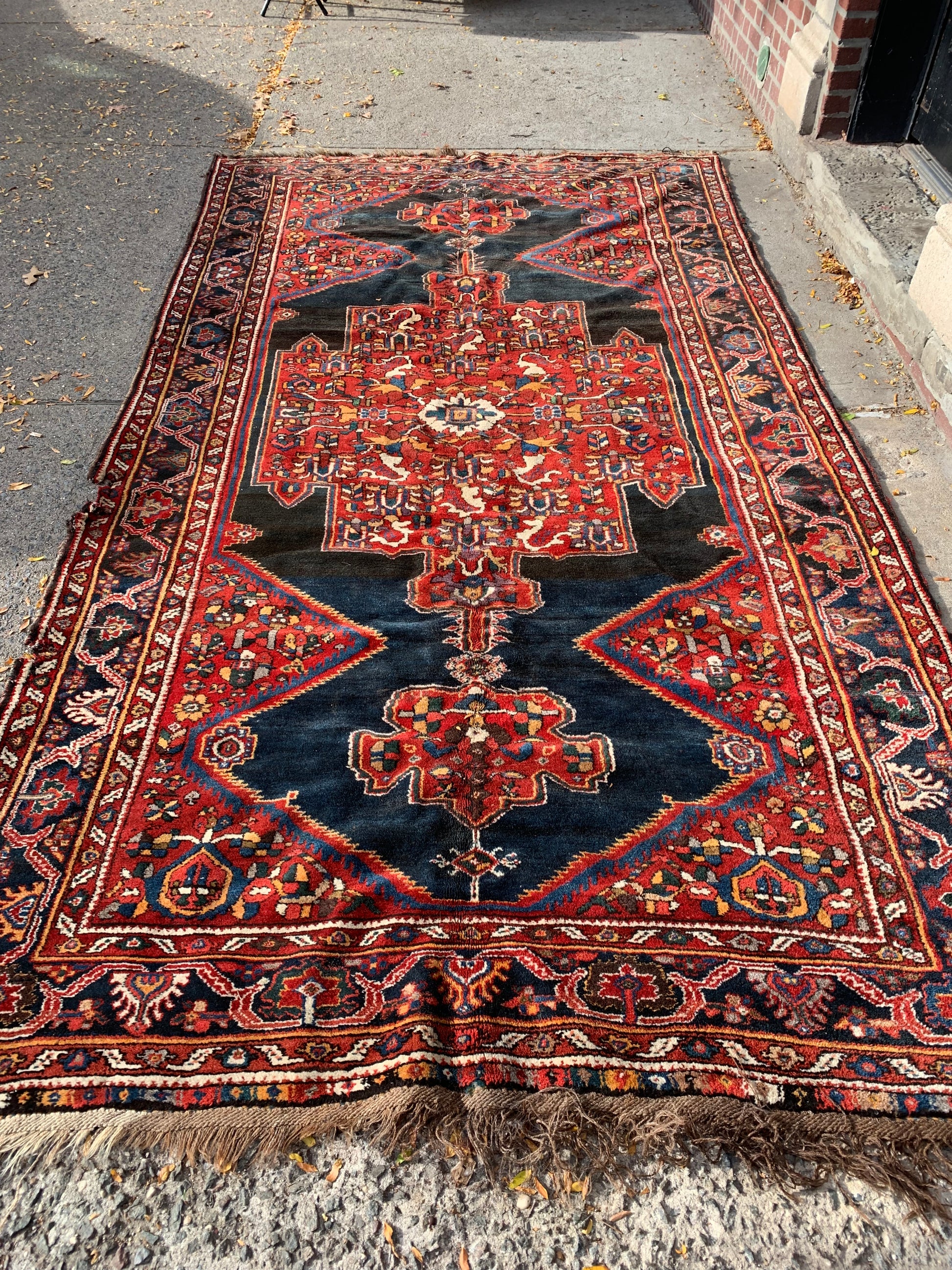 Large rectangular Persian wool rug for living spaces.
