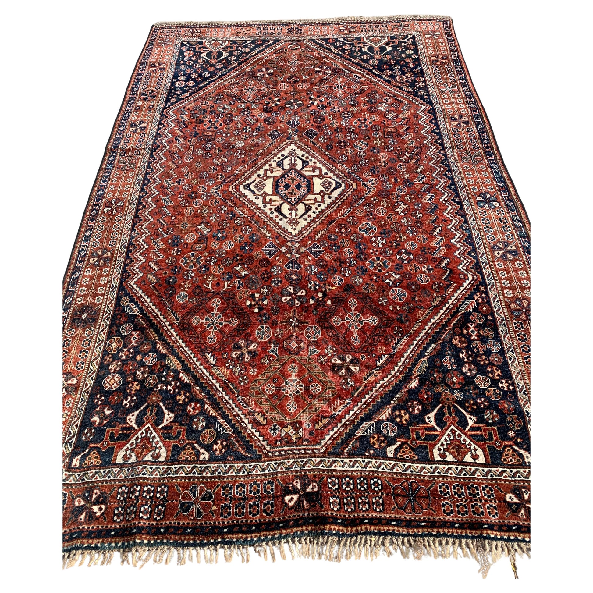 Handmade antique Persian Qashqai rug from the 1900s.
