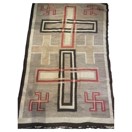 Full top view of the antique Navajo rug showing the complete geometric diamond pattern.

