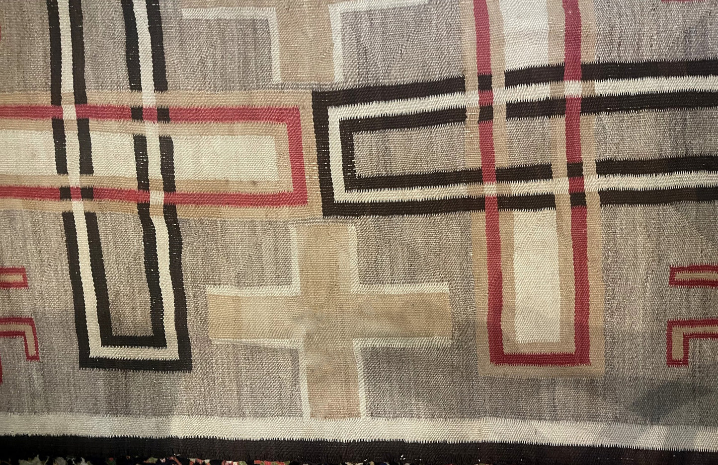 Detail of the natural wool texture and the rich, mellowed color palette.

