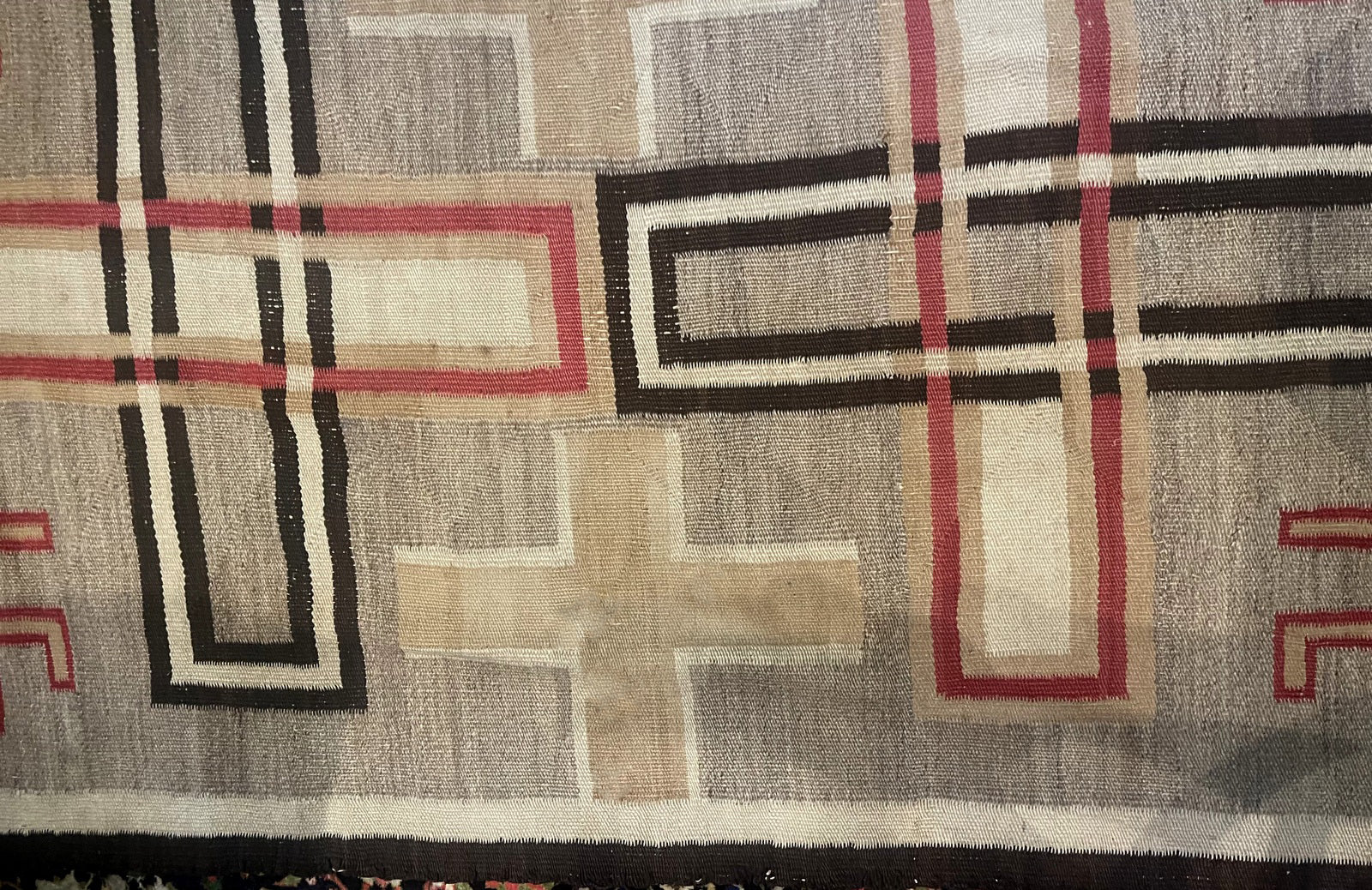 Detail of the natural wool texture and the rich, mellowed color palette.

