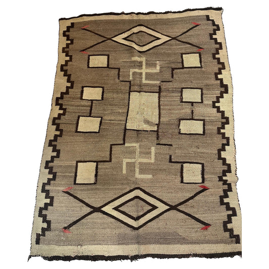 Full top view of the antique Navajo rug showing the complete geometric diamond pattern.

