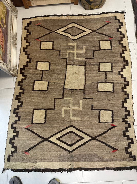 Close-up detail of a large central diamond motif in solid black.

