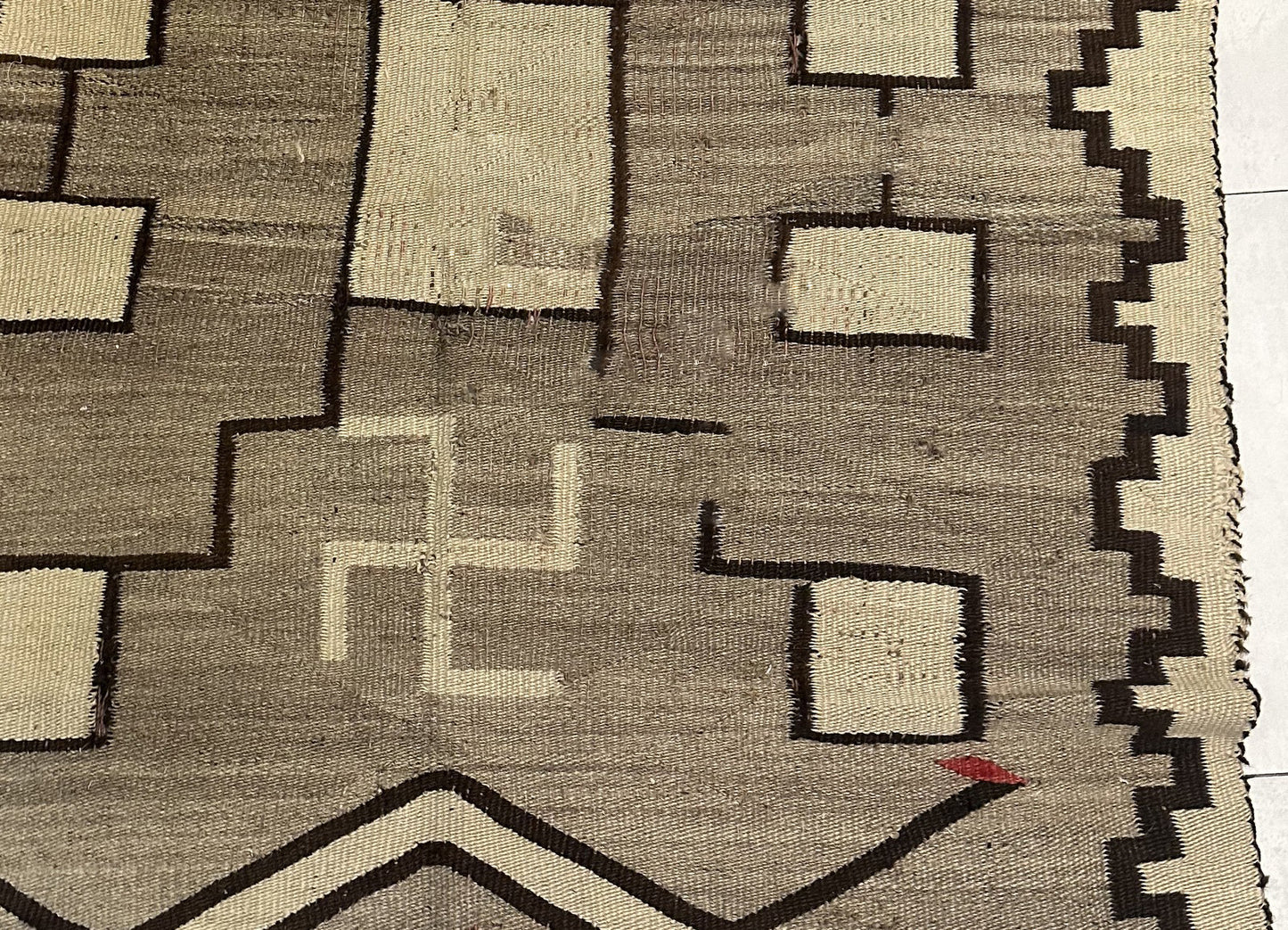 Close-up of the border design with its traditional geometric motifs.

