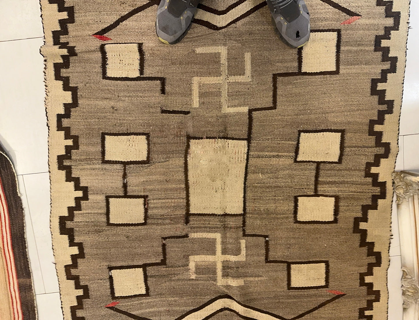 Texture shot showing the handwoven wool and the rug's substantial weave.

