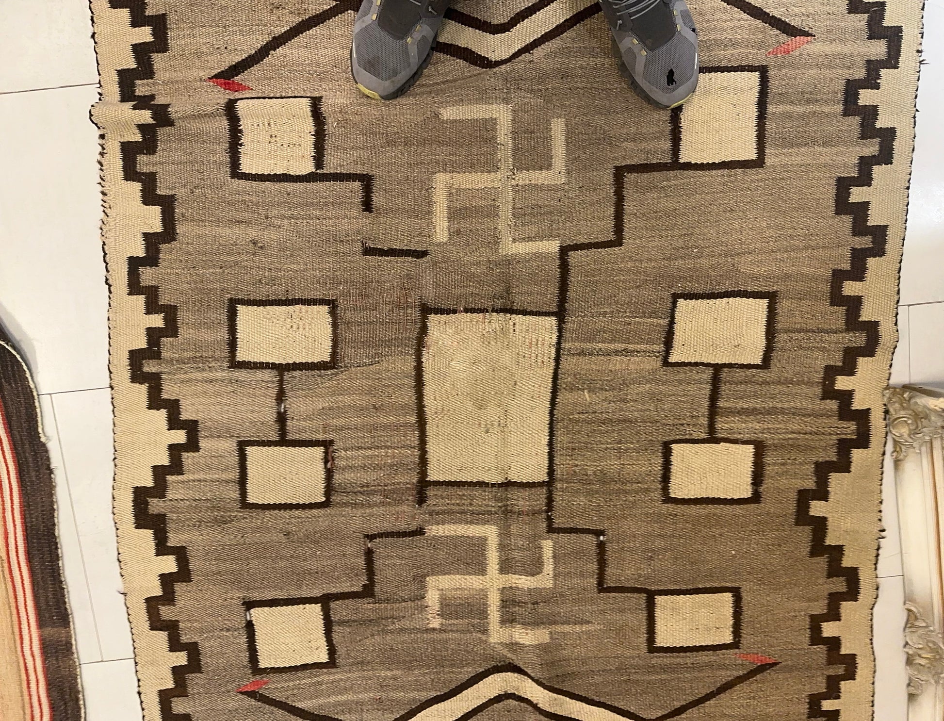 Texture shot showing the handwoven wool and the rug's substantial weave.


