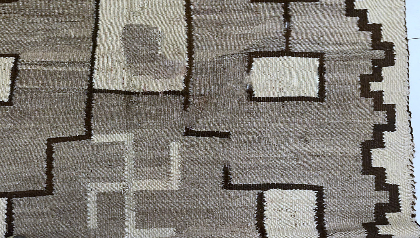 Close-up on the beautiful patina and soft sheen of the aged wool.

