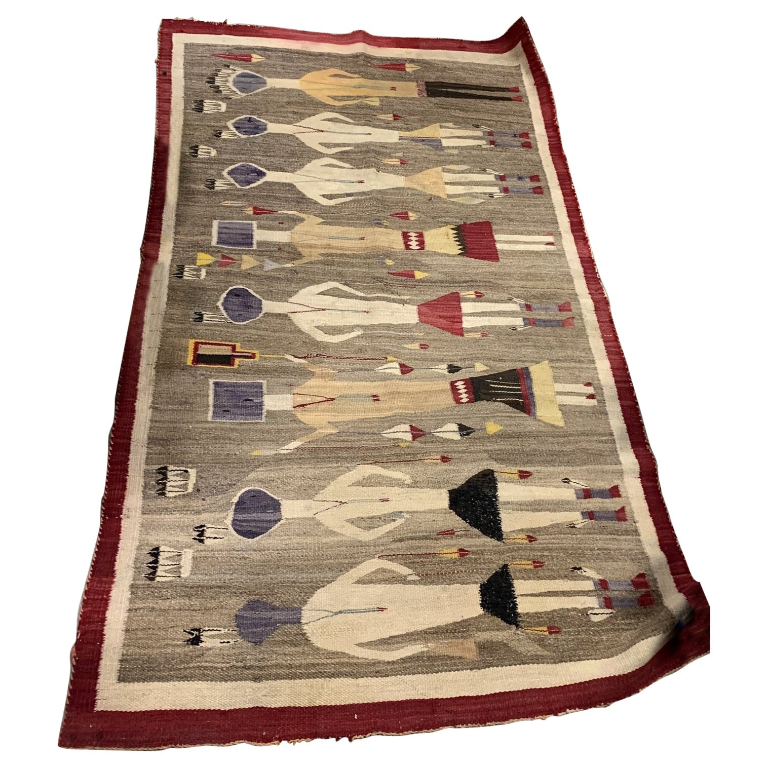 Handwoven antique Navajo Yei rug with symbolic figures, early 1900s
