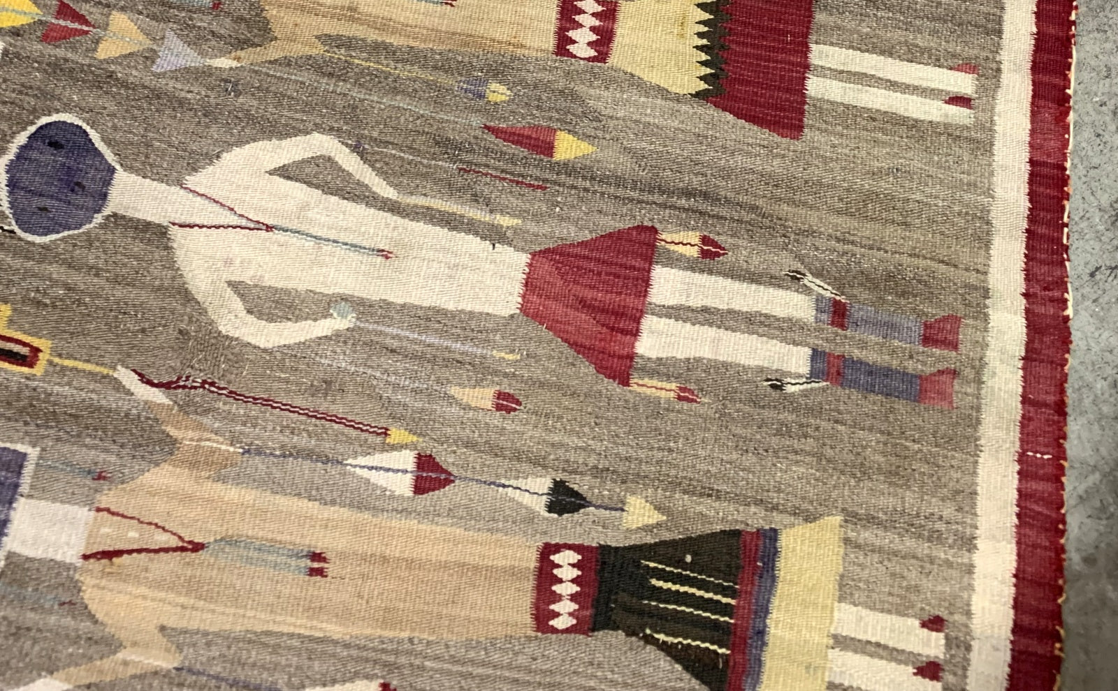 Vintage Navajo rug with earthy tones and tribal motifs
