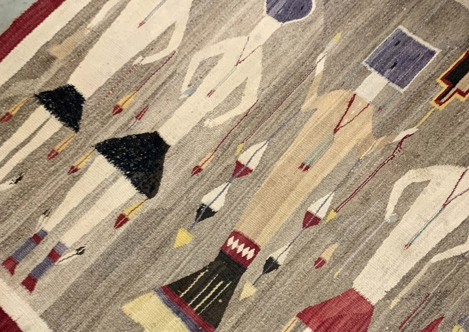 Navajo Yei rug displaying vibrant patterns and earthy colors
