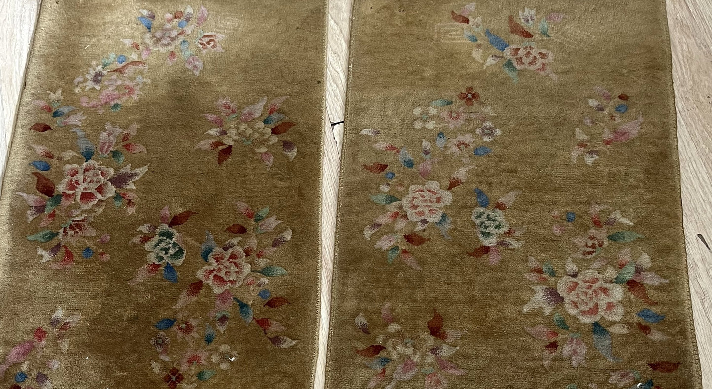 Close-up of intricate Art Deco patterns on antique Chinese wool rugs
