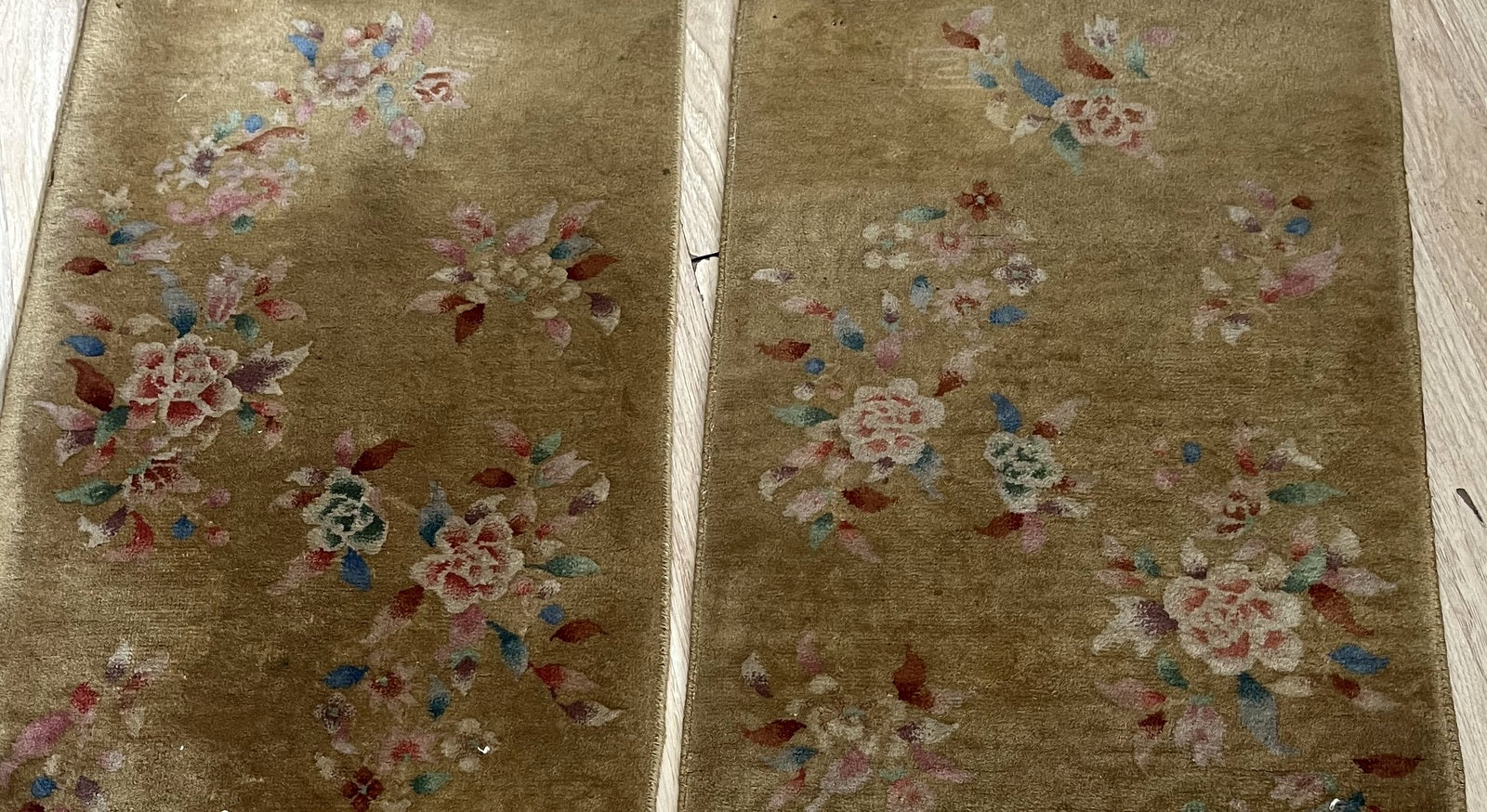 Close-up of intricate Art Deco patterns on antique Chinese wool rugs
