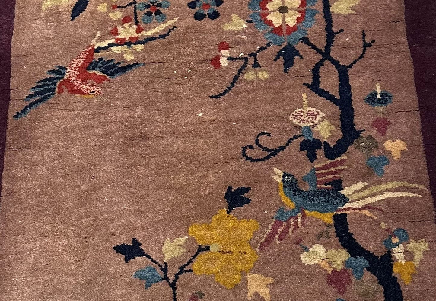 Close-up of handwoven wool on antique Chinese Art Deco rug
