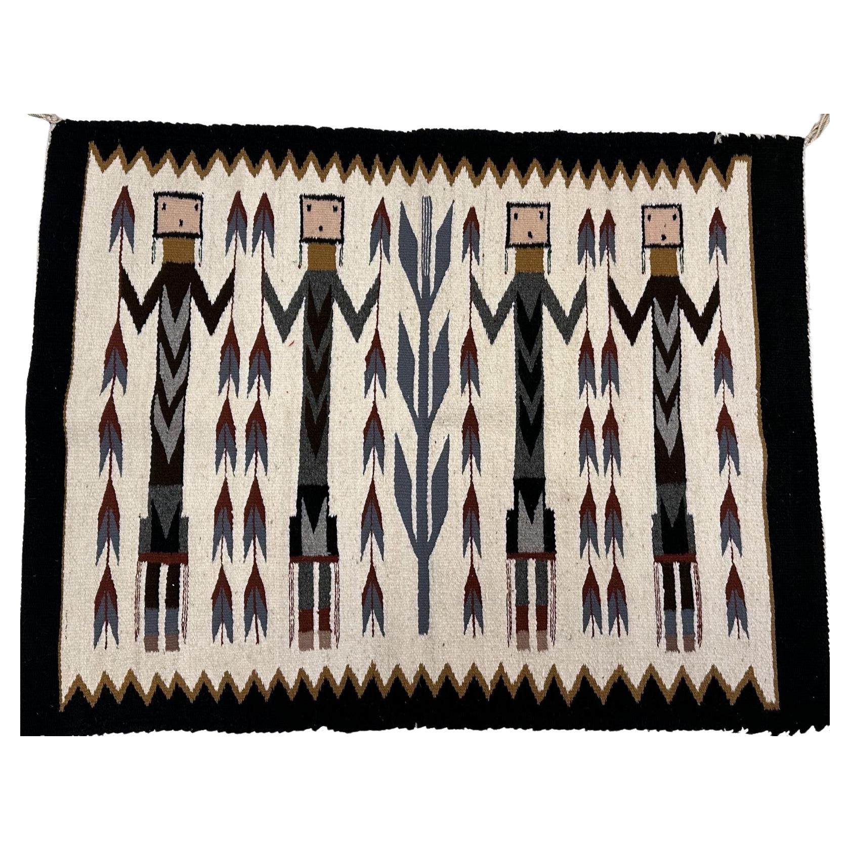 Antique Navajo Yei rug with four ceremonial figures

