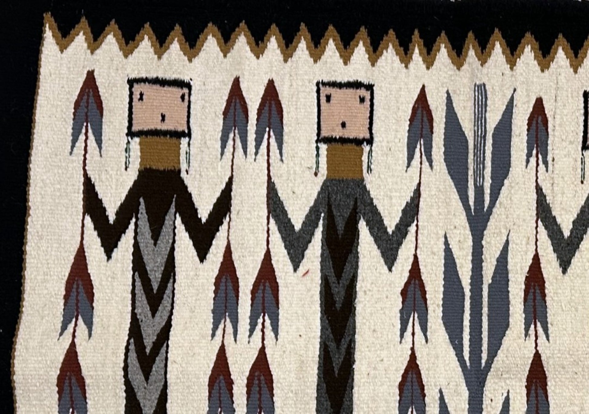 Stylized human figures holding feather-like objects

