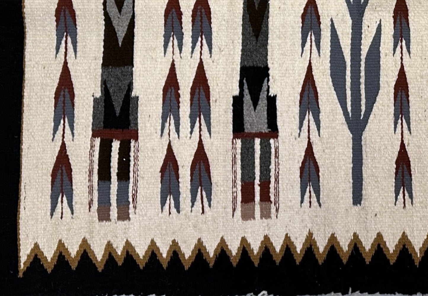 Close-up of Yei figure details and symbolism

