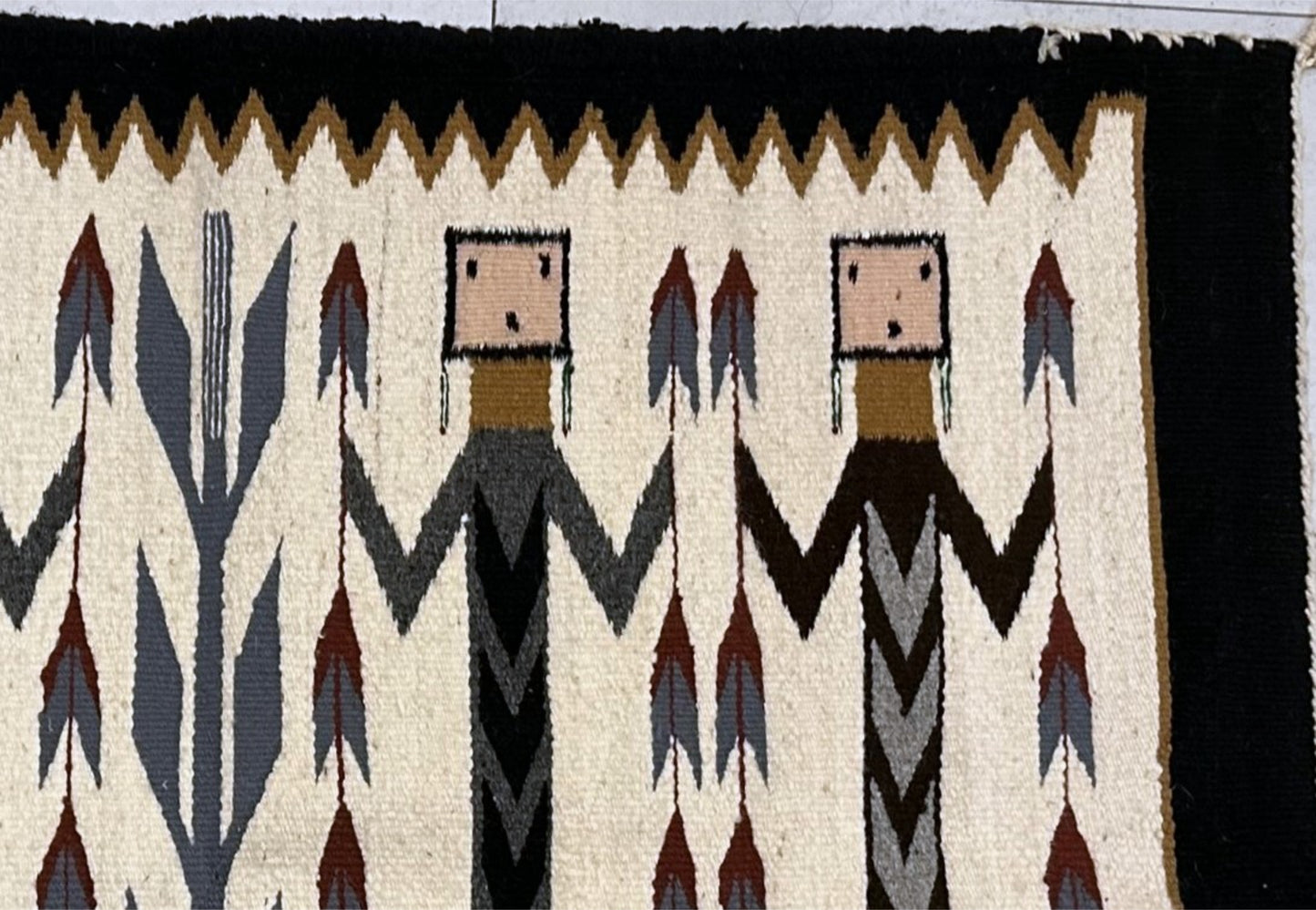 Cream background highlighting ceremonial figures

