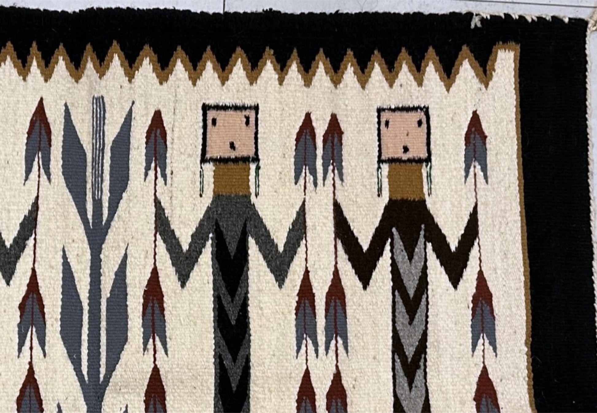 Cream background highlighting ceremonial figures

