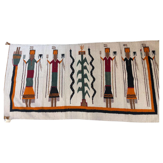 Textile with decorative pattern of figures and a central design on a white background