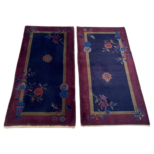 Pair of antique Chinese Art Deco rugs on a wooden floor.

