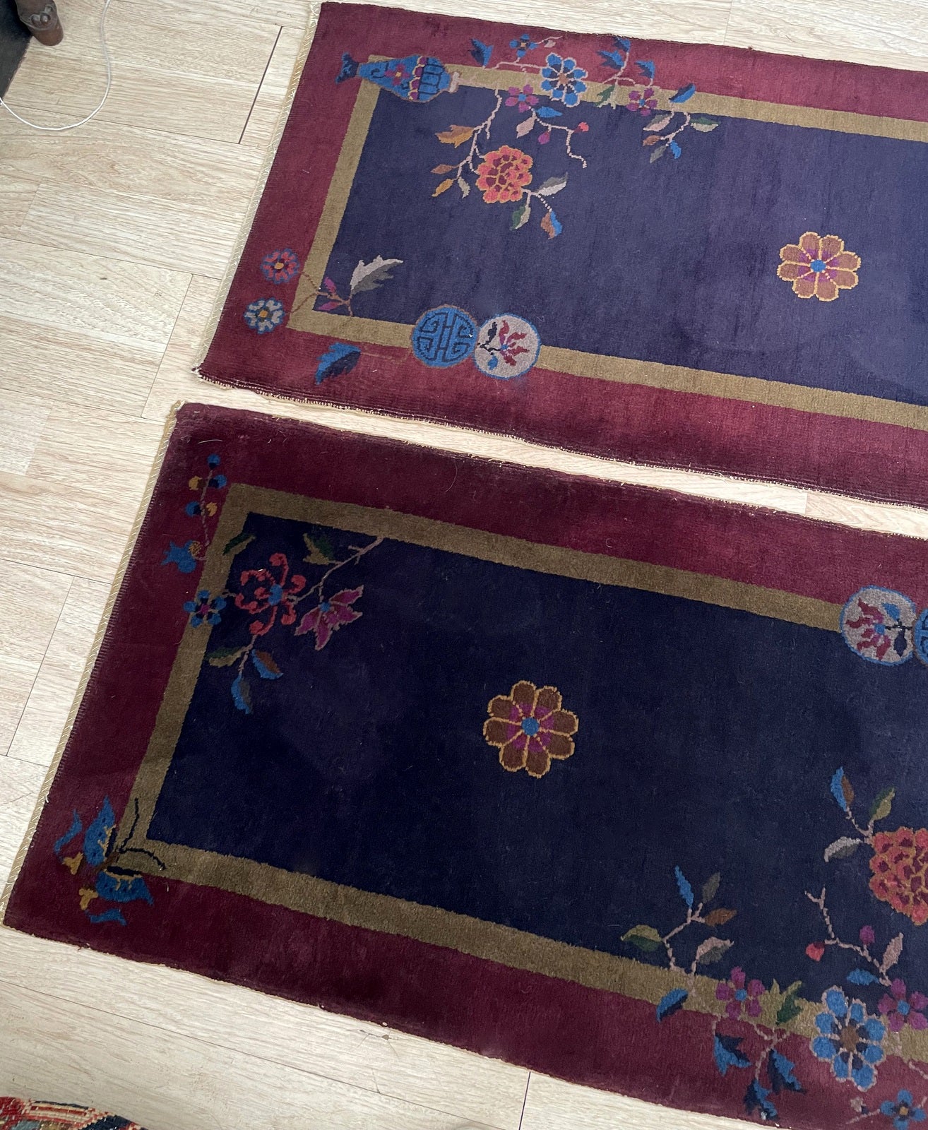 One rug from the pair showcasing its complete rectangular layout.

