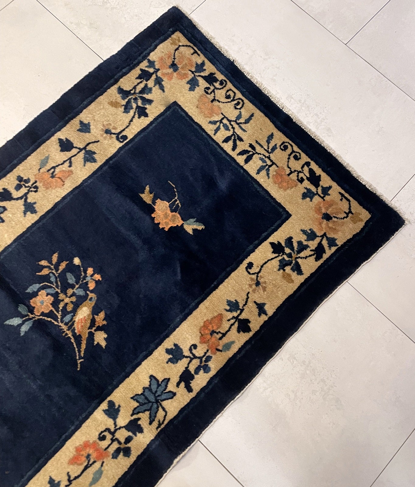 Textured surface of the hand-knotted wool pile in excellent condition.

