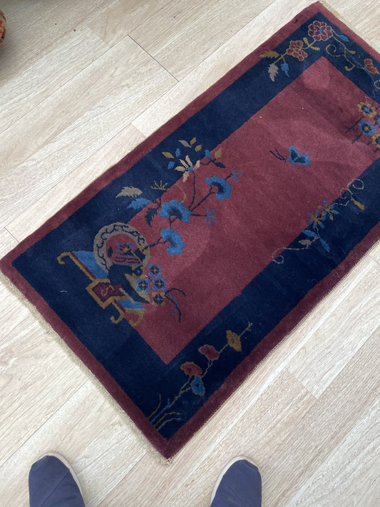 Close-up of the stylized blossoming tree motif in indigo blue.

