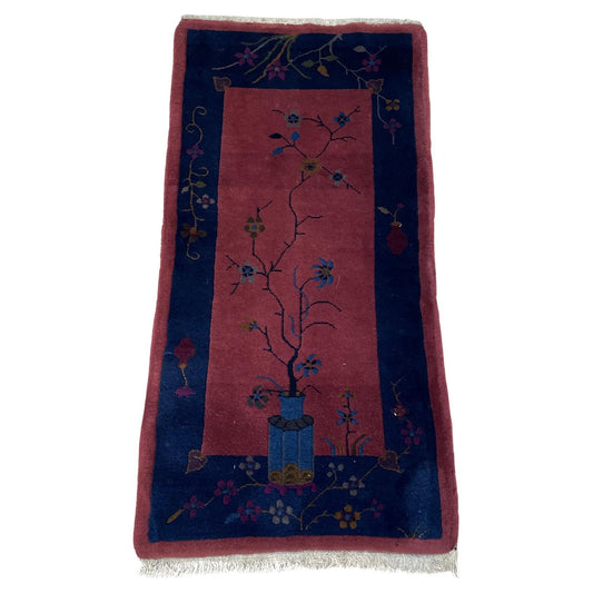 Antique Chinese Art Deco rug with a warm brick red field.

