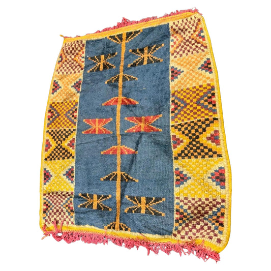 Antique Moroccan Berber rug with a strong teal blue field.

