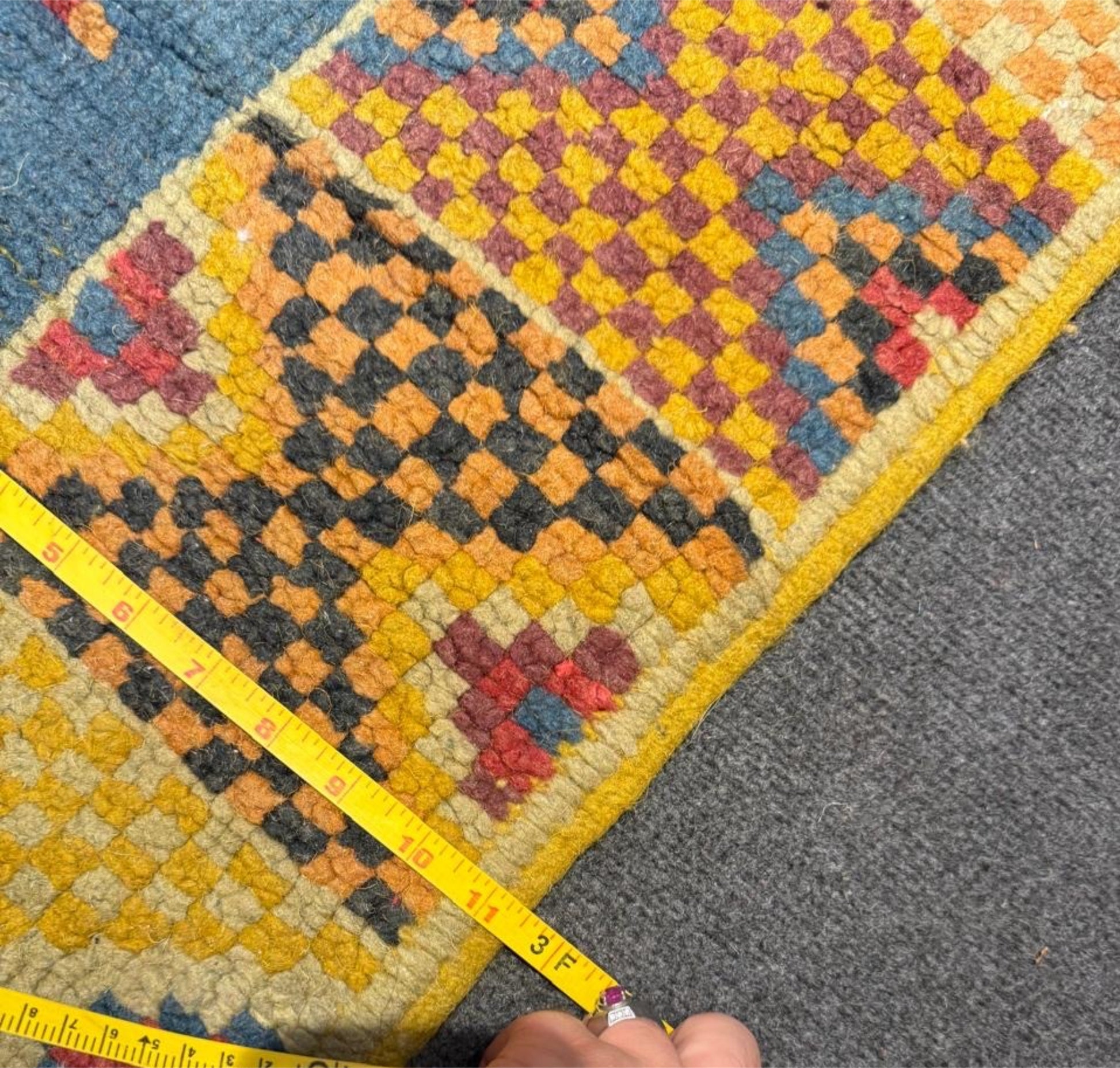 Full view of the square rug showcasing its balanced layout.

