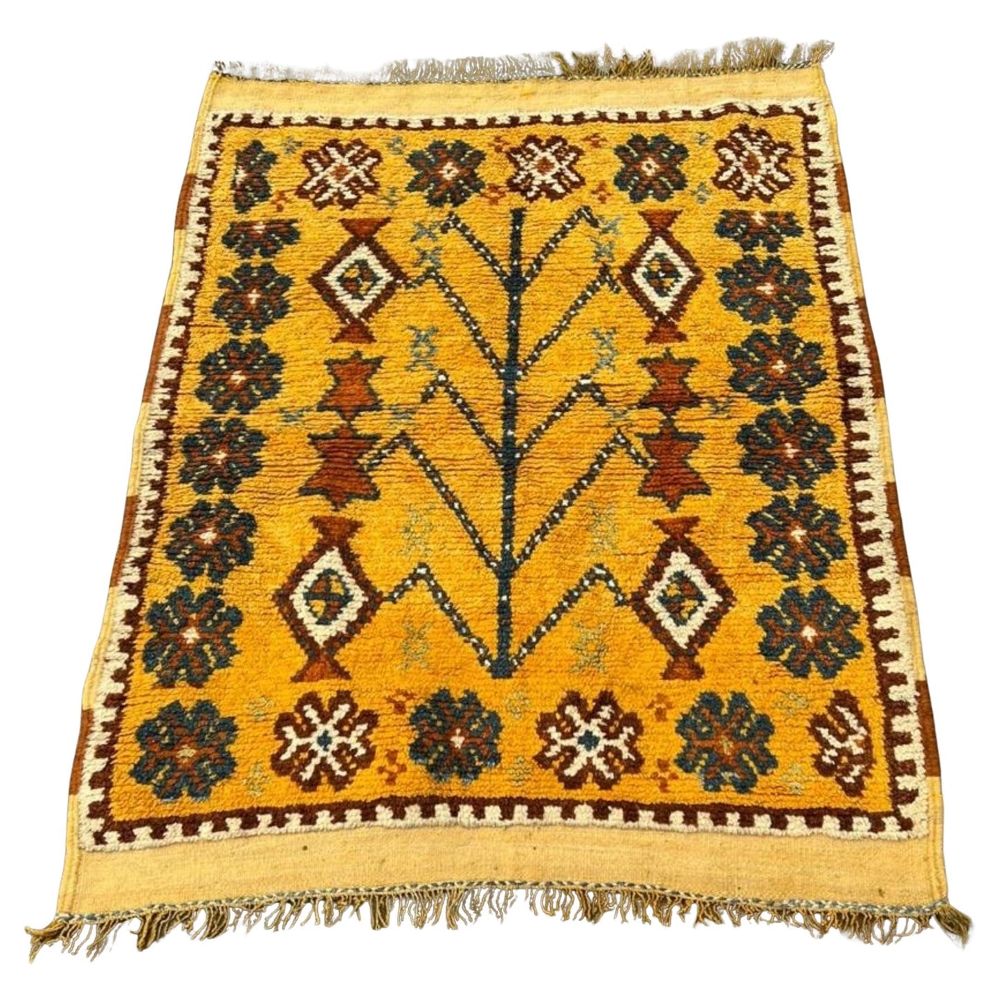 Antique Moroccan Berber rug with a brilliant sunny yellow field.

