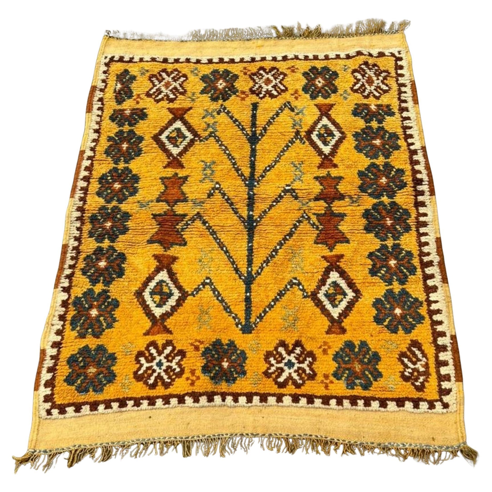 Antique Moroccan Berber rug with a brilliant sunny yellow field.

