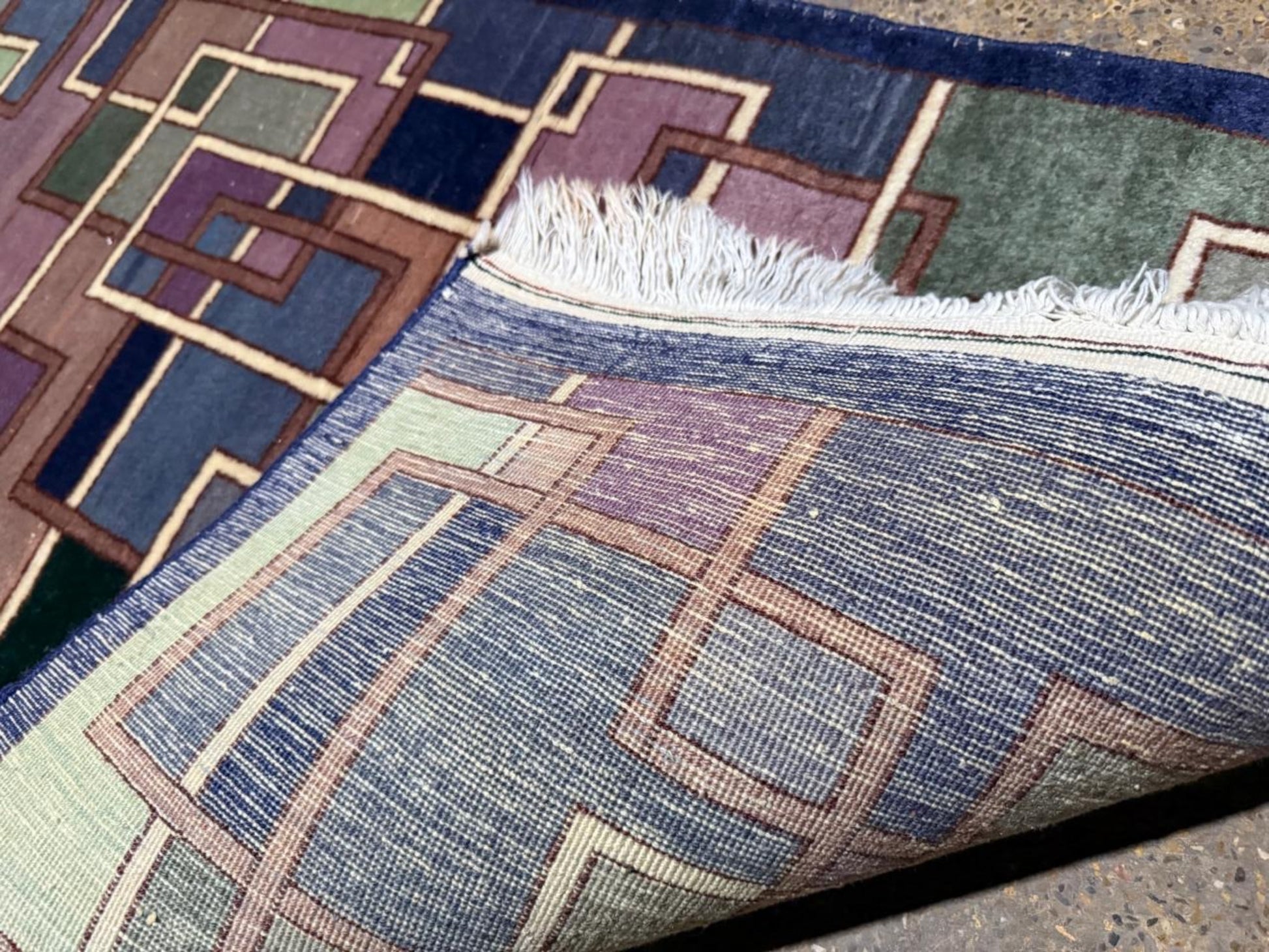 Full view of the rug showcasing the dynamic abstract composition.

